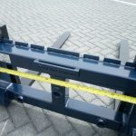Pallet tine support bracket set with bale spike bushes
